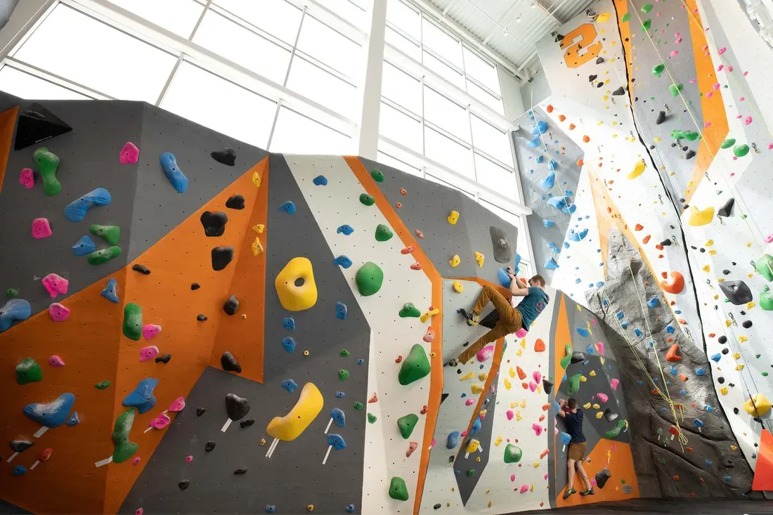 Student rock climbing at the The Barnes Center.